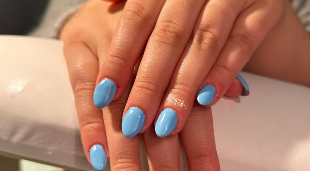 Sky blue nails by Brioni Nails at Prince Albert, Saskatchewan, CA showcasing a sleek manicure.