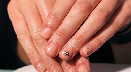 Elegant star-themed nail design at Brioni Nails, Prince Albert, Saskatchewan, CA.