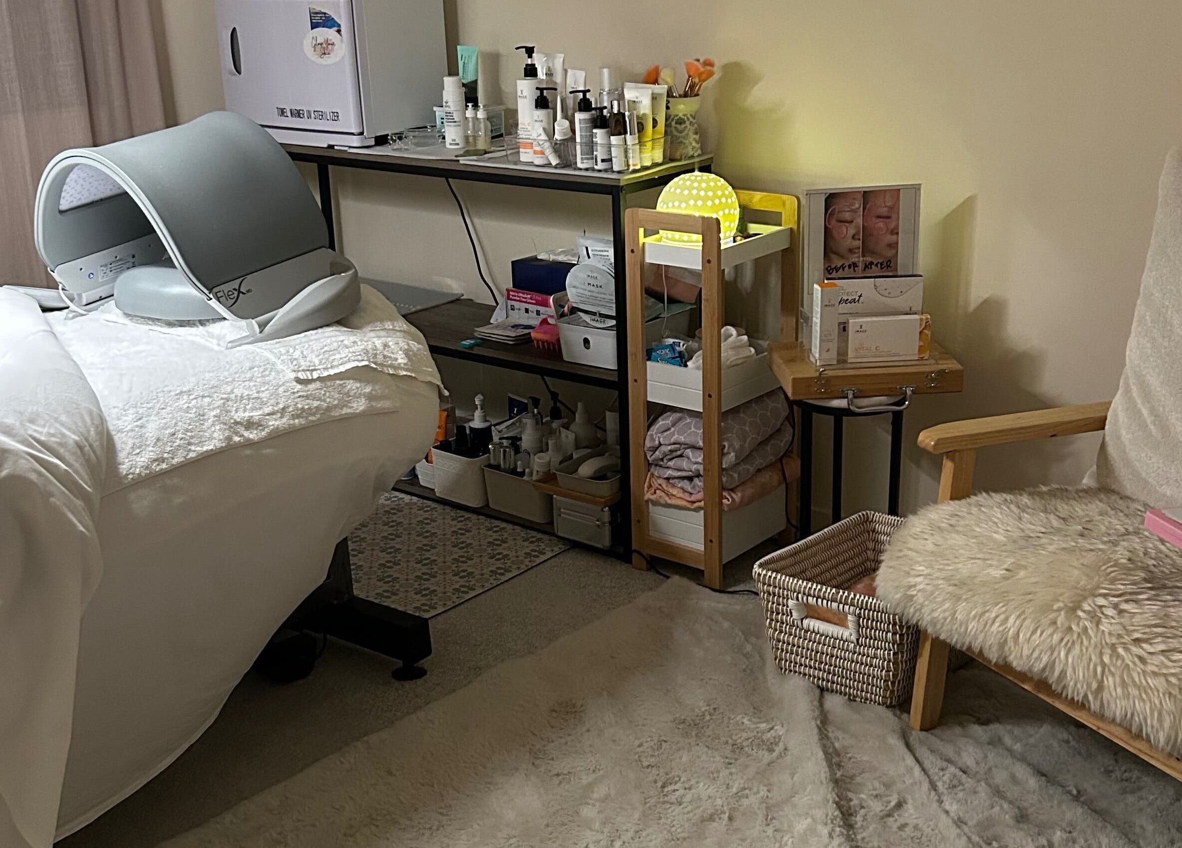Relaxing spa room at Glow Your Skin by Shona, Chapel Hill, Queensland, AU with treatment bed and skincare products.
