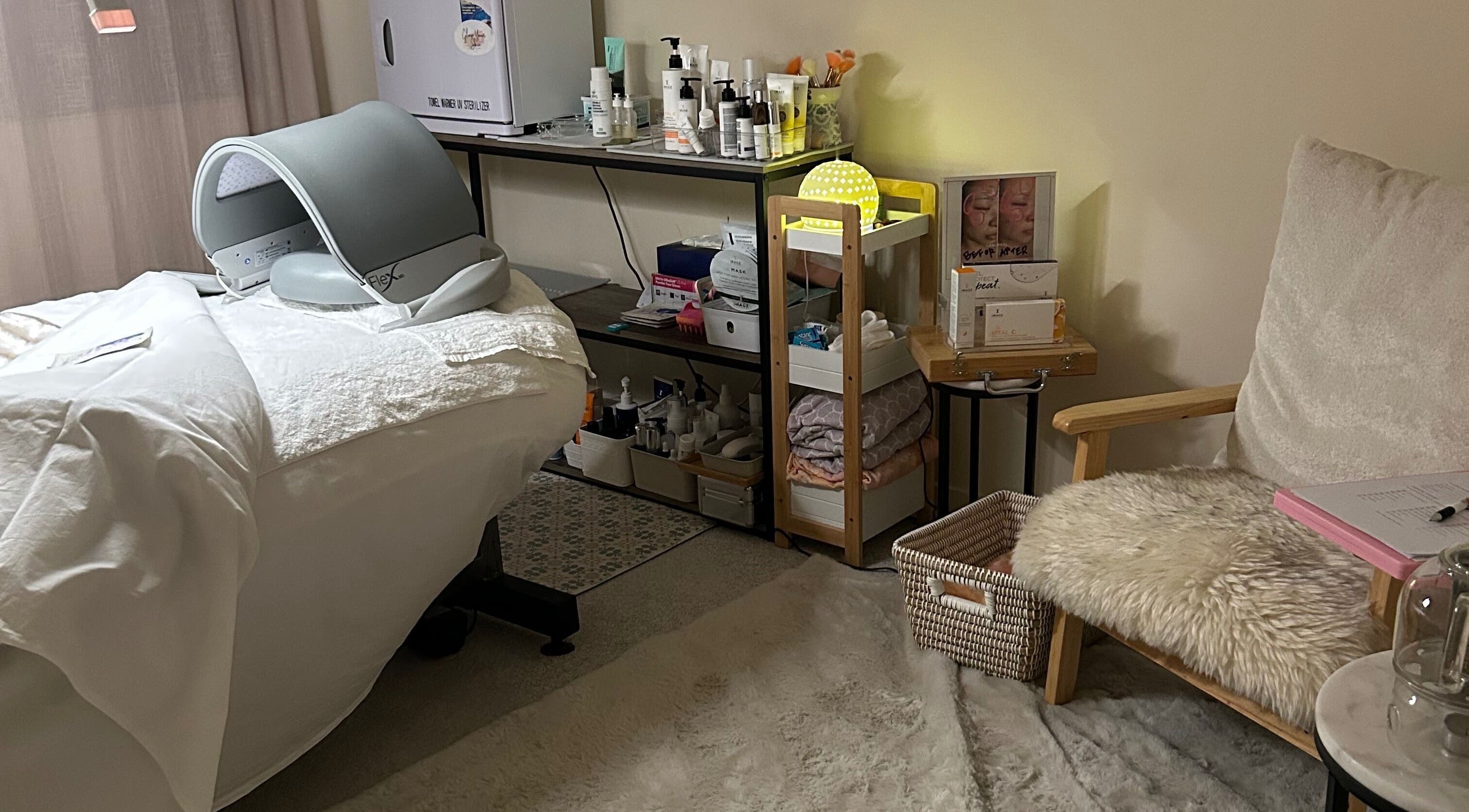 Relaxing spa room at Glow Your Skin by Shona, Chapel Hill, Queensland, AU with treatment bed and skincare products.