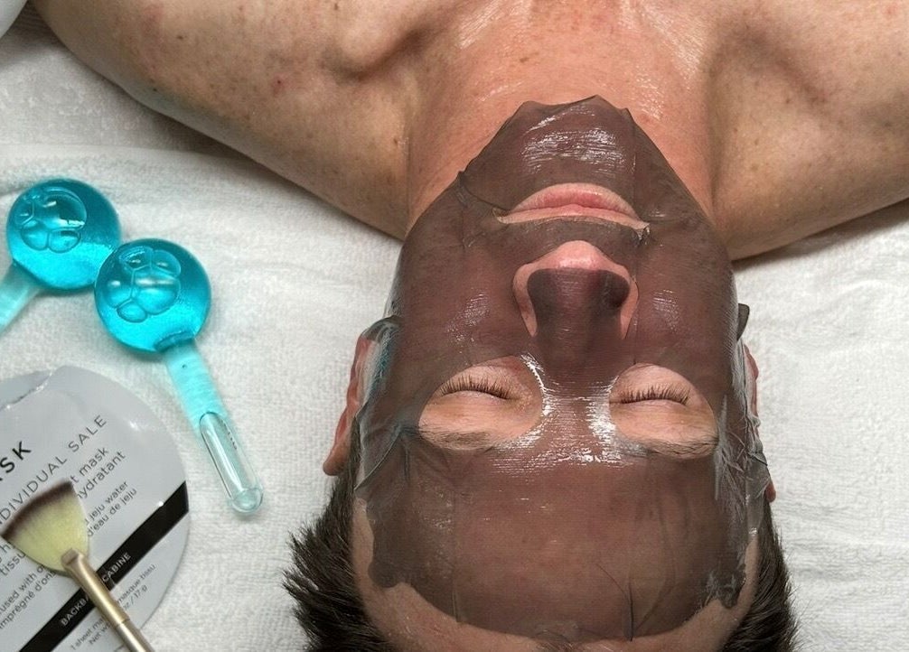 Man receiving facial treatment at Glow Your Skin by Shona, Chapel Hill, Queensland, AU, with a hydrating mask.