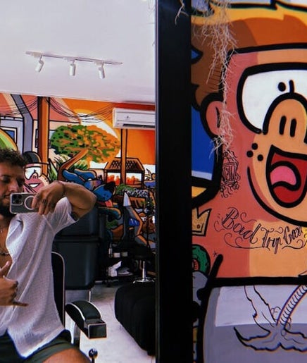 Colorful interior of Social Animals Barbershop and Tattoo Parlour (Bingin) in Bali, Bali, ID featuring vibrant art.