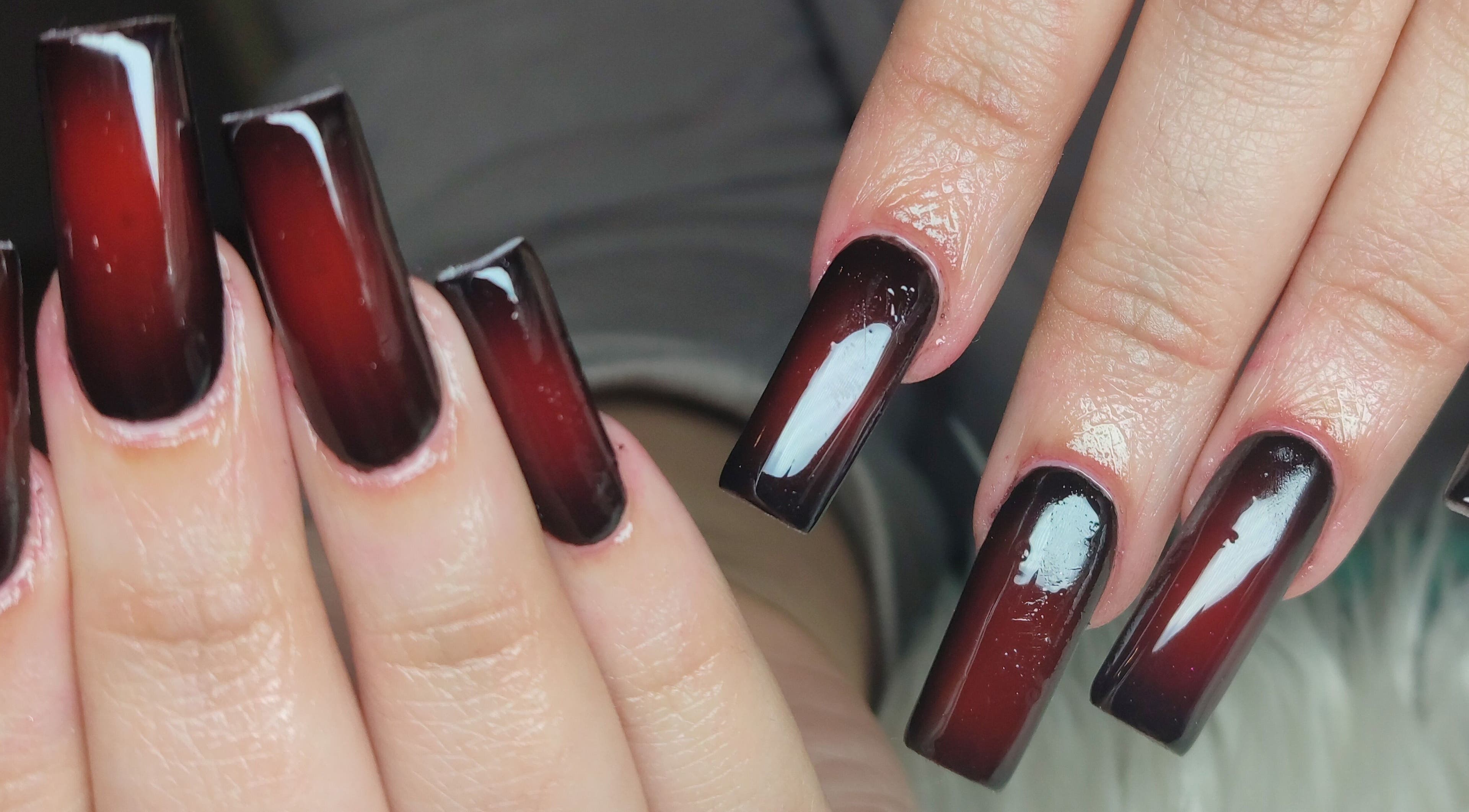 Elegant red ombre nail design at Tiamkupinails Woodstock in Cape Town, Western Cape, ZA.