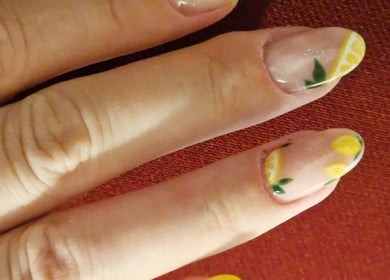 Lemon-themed nail art at Jennie's Gels & Beauty in Pencoed, Wales, GB. Perfect for a fresh summer look.