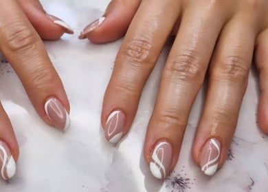Stylish white striped nail art at Jennie's Gels & Beauty, Pencoed, Wales, GB.