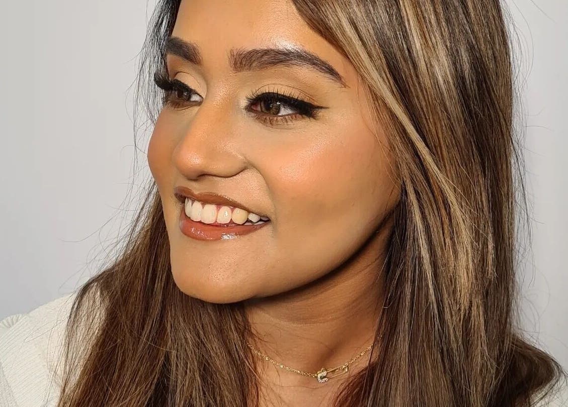 Woman with glowing makeup at The Salon at Westway, Marksbury, England, GB, showcasing expert beauty services.