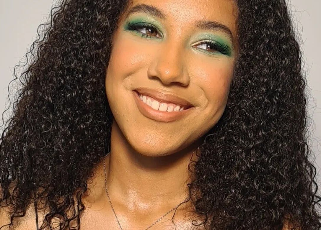 Woman with vibrant makeup smiling at The Salon at Westway, Marksbury, England, GB.