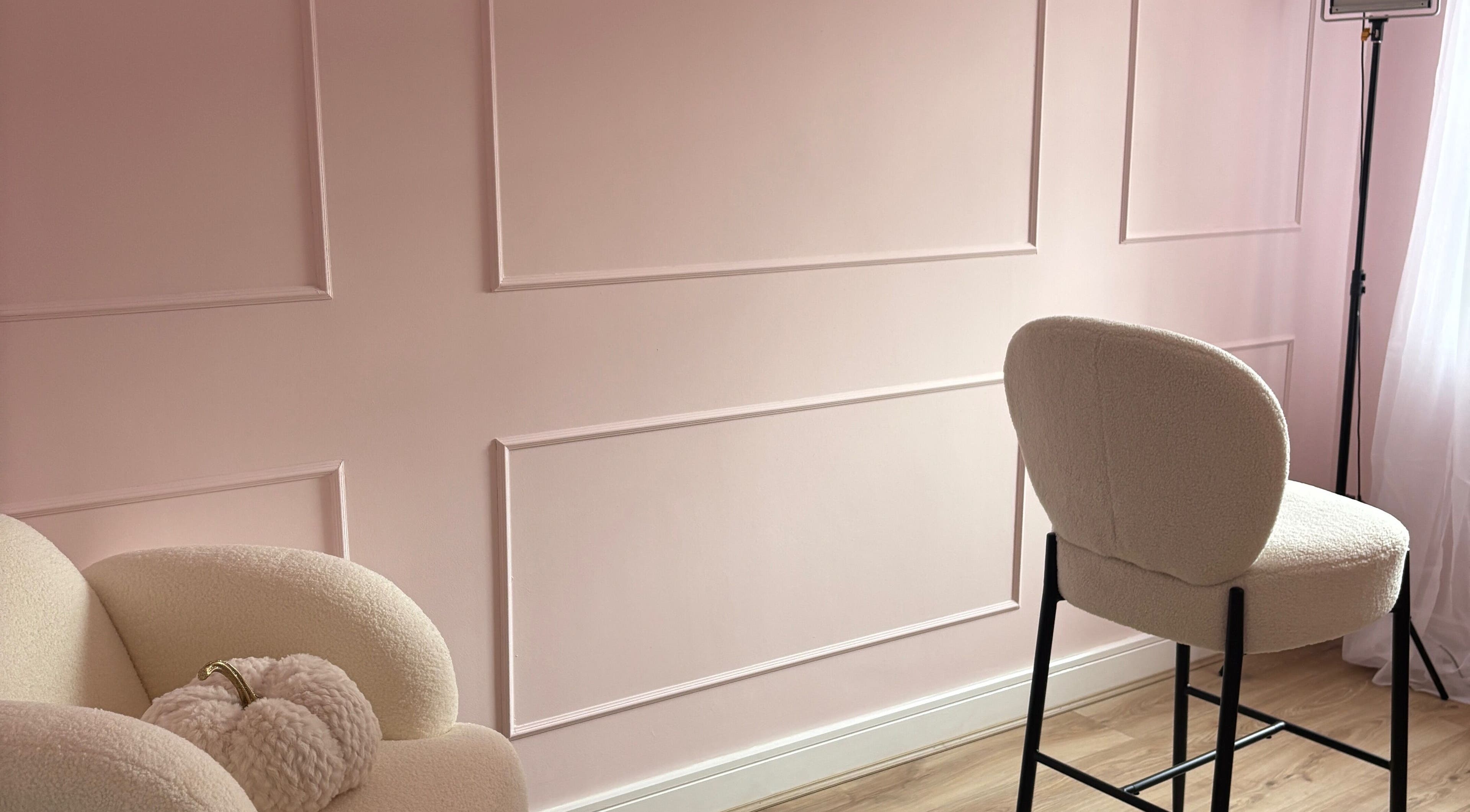 Elegant seating area with pastel pink walls at Face by Caitlyn, Church Village, Wales, GB.