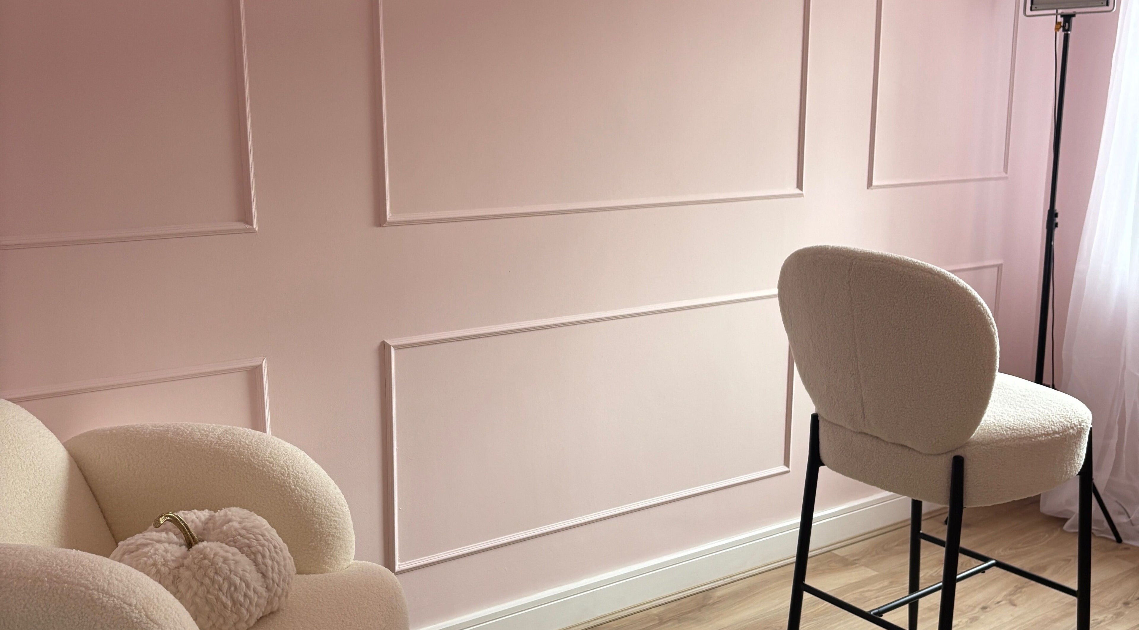 Elegant seating area with pastel pink walls at Face by Caitlyn, Church Village, Wales, GB.