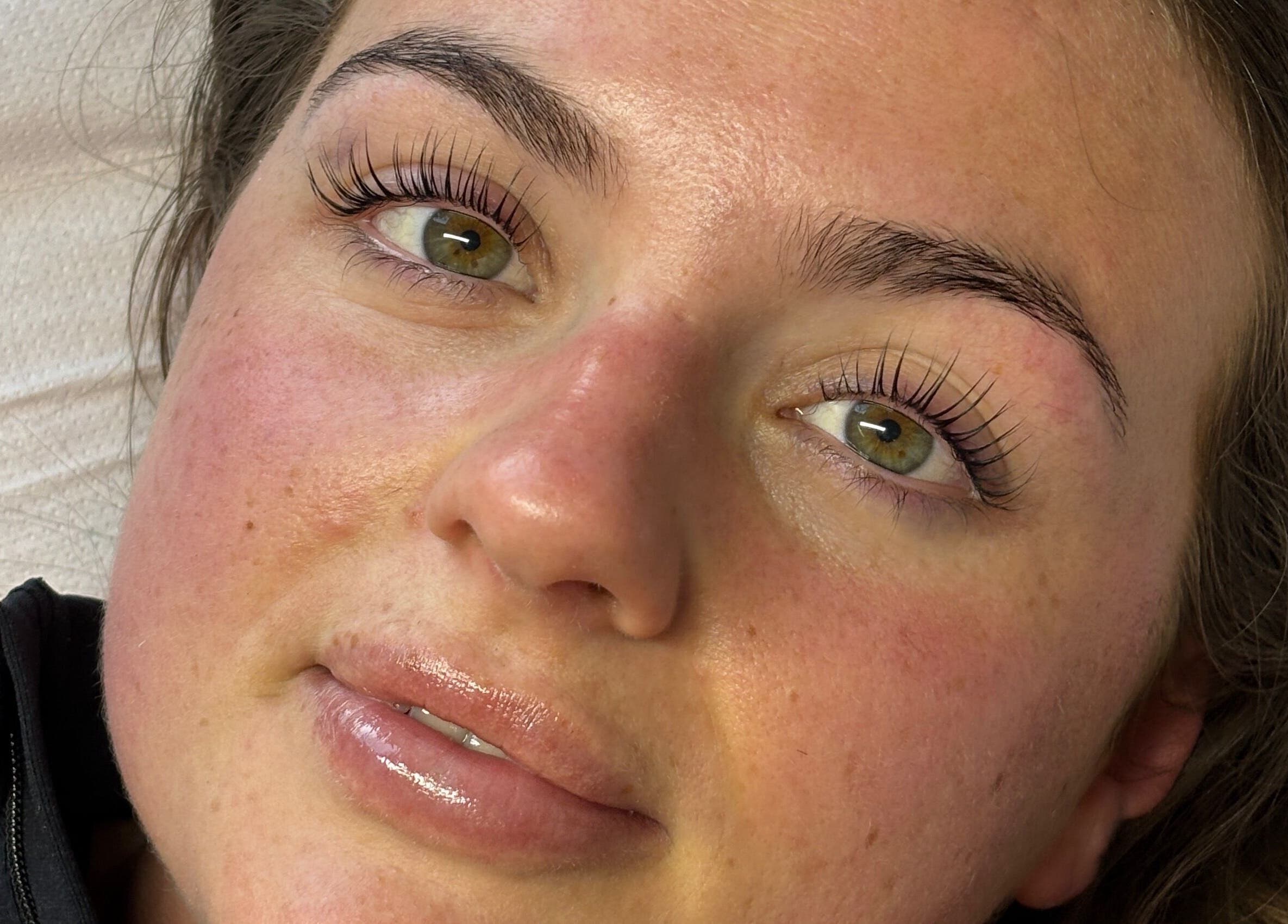 Close-up of a client's face with radiant skin after treatment at Face by Caitlyn in Ginger by Zoe, Cardiff, Wales, GB.