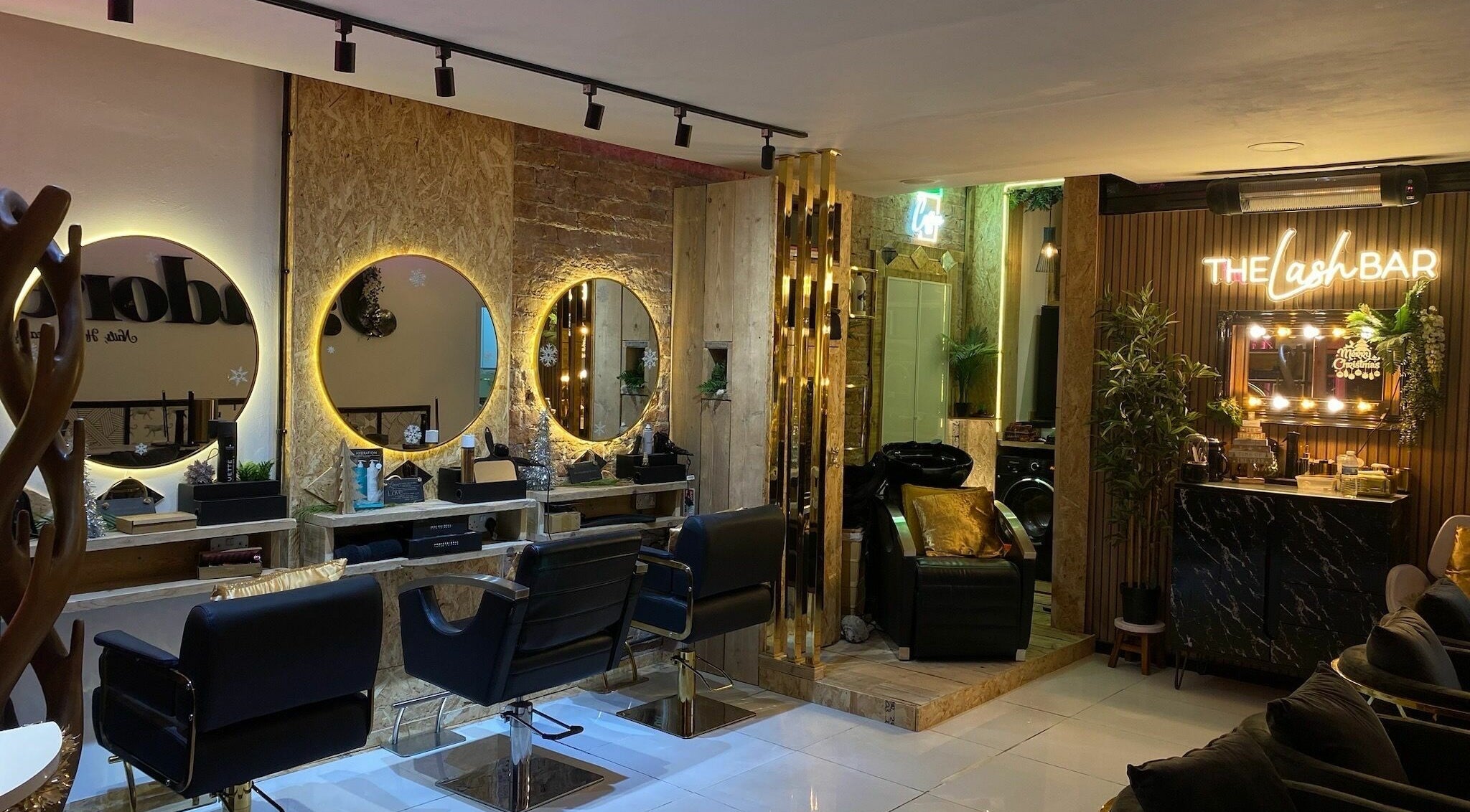 Chic interior of Jadore Nails, Hair & Beauty in Sunderland, England, GB, featuring luxurious salon chairs and a vibrant decor.