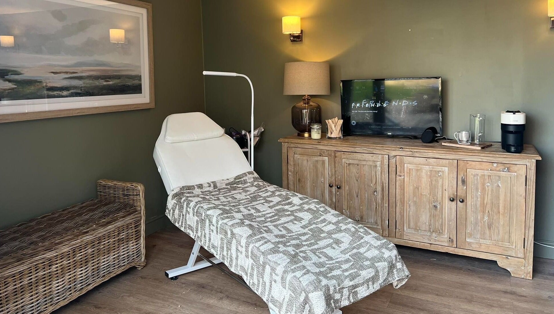 Cozy treatment room at The Wax Hut, Kinsham Tewkesbury, England, GB, with massage table and ambient lighting.