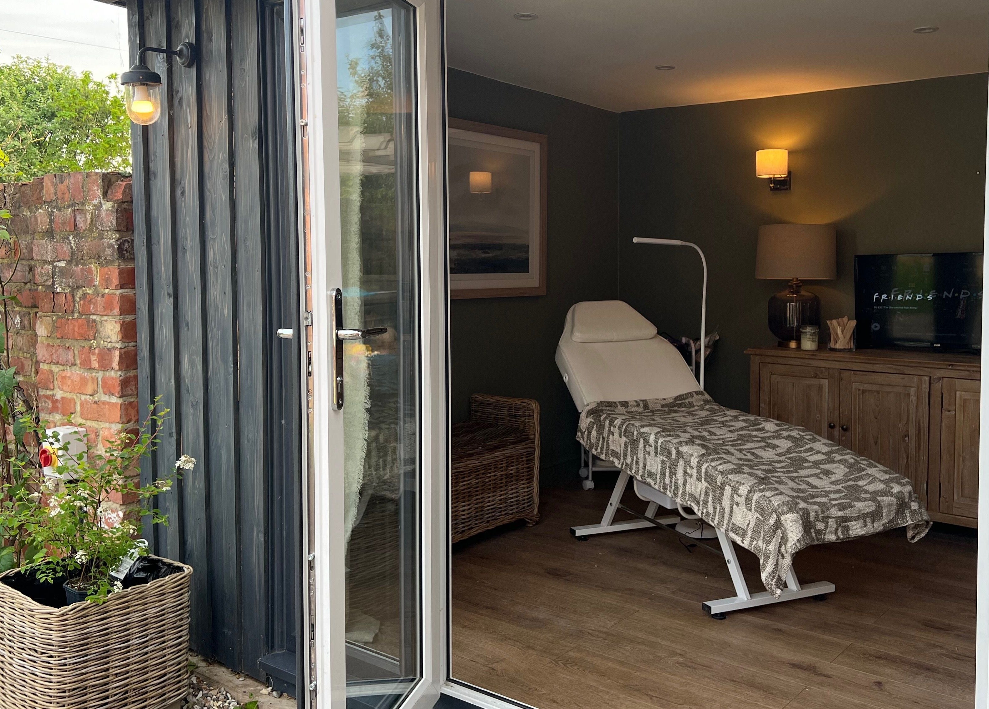 Cozy treatment room at The Wax Hut, Kinsham Tewkesbury, England, GB with a relaxing ambiance.