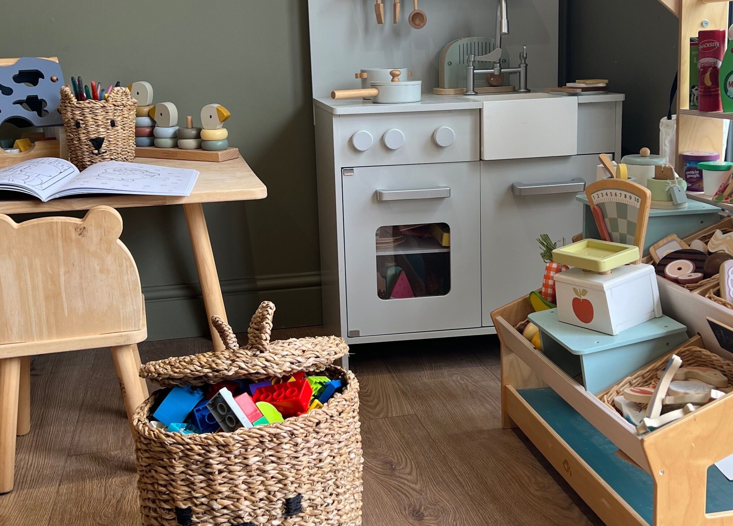 Children's play area at The Wax Hut, Kinsham Tewkesbury, England, GB featuring toys and a mini kitchen.