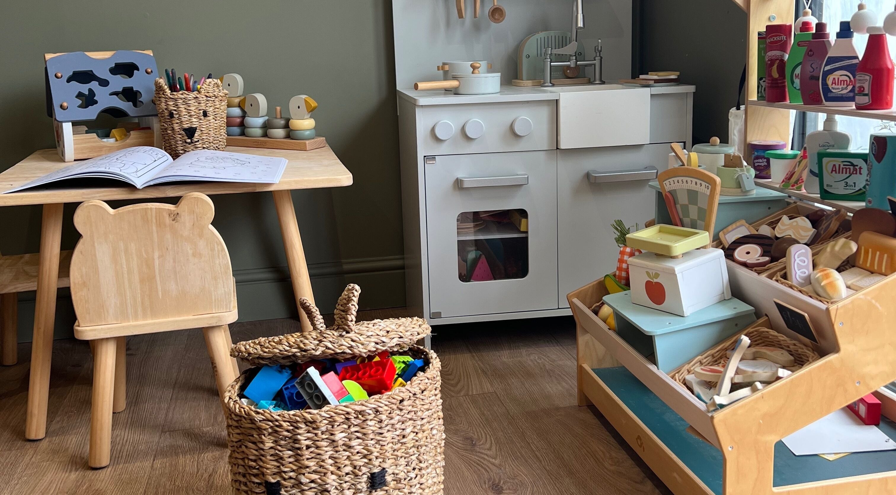 Children's play area at The Wax Hut, Kinsham Tewkesbury, England, GB featuring toys and a mini kitchen.