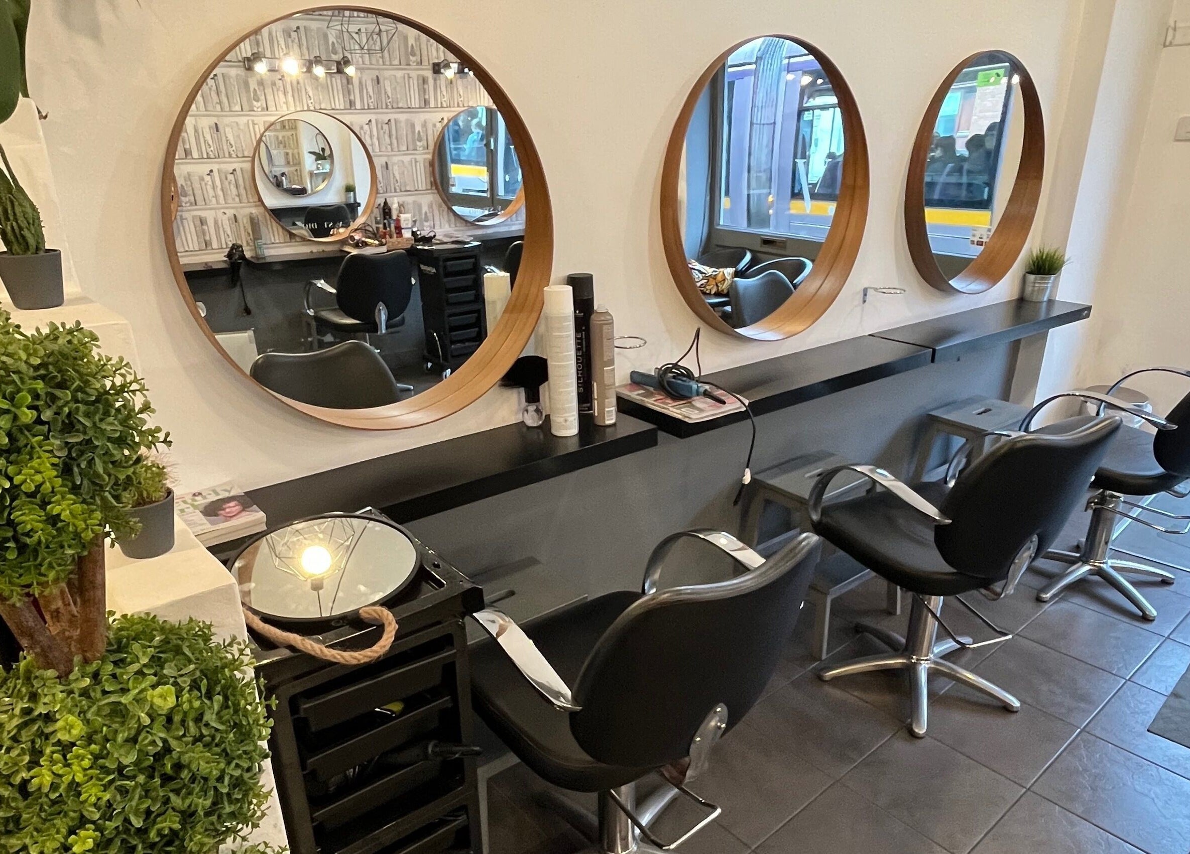 MP Studio Hair in Dublin, County Dublin, IE features chic salon chairs and mirrors.