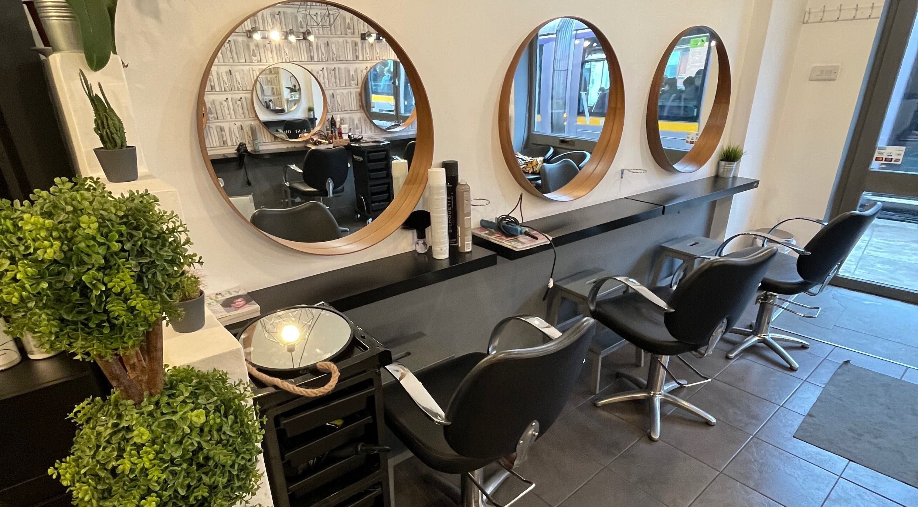 MP Studio Hair in Dublin, County Dublin, IE features chic salon chairs and mirrors.
