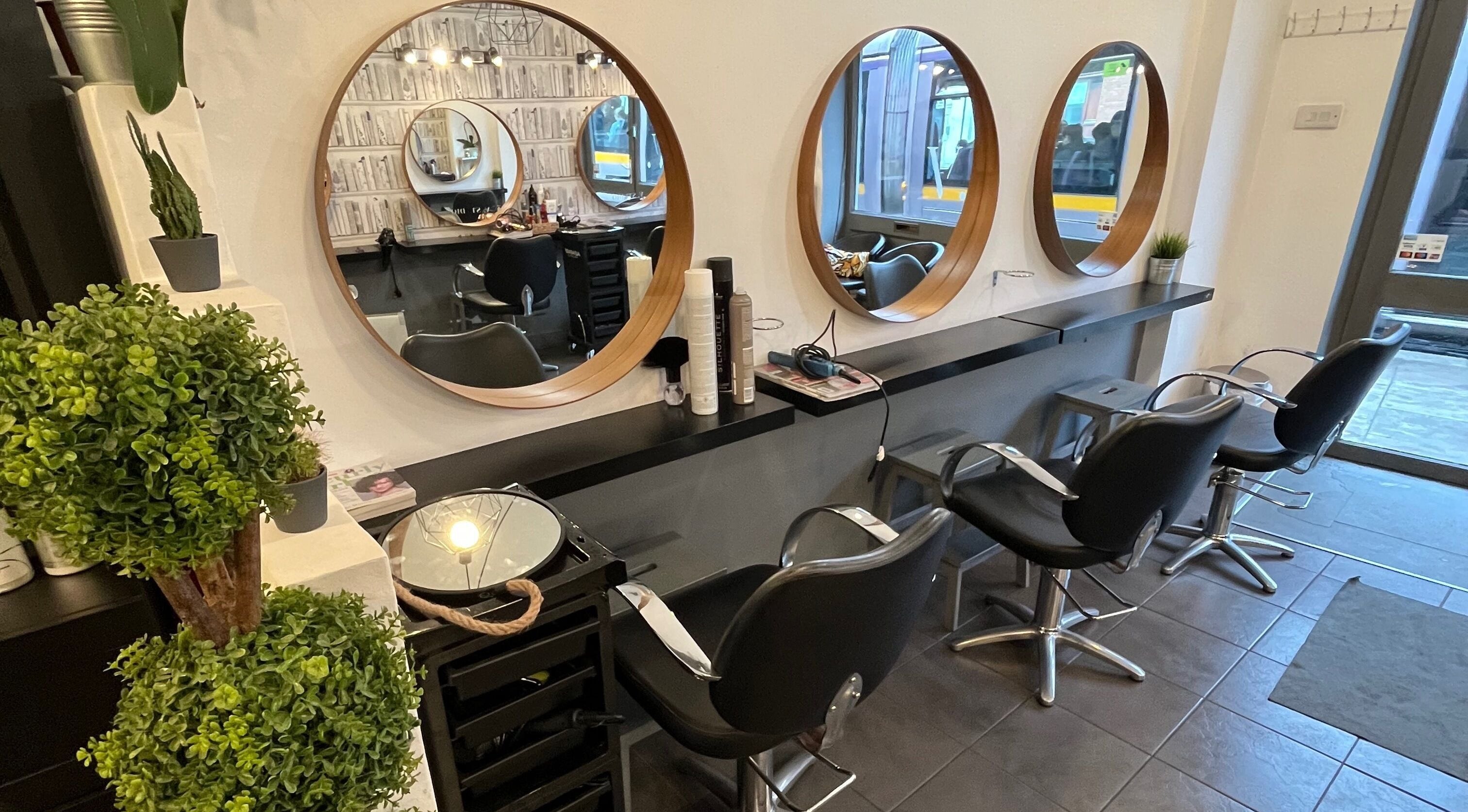 MP Studio Hair in Dublin, County Dublin, IE features chic salon chairs and mirrors.