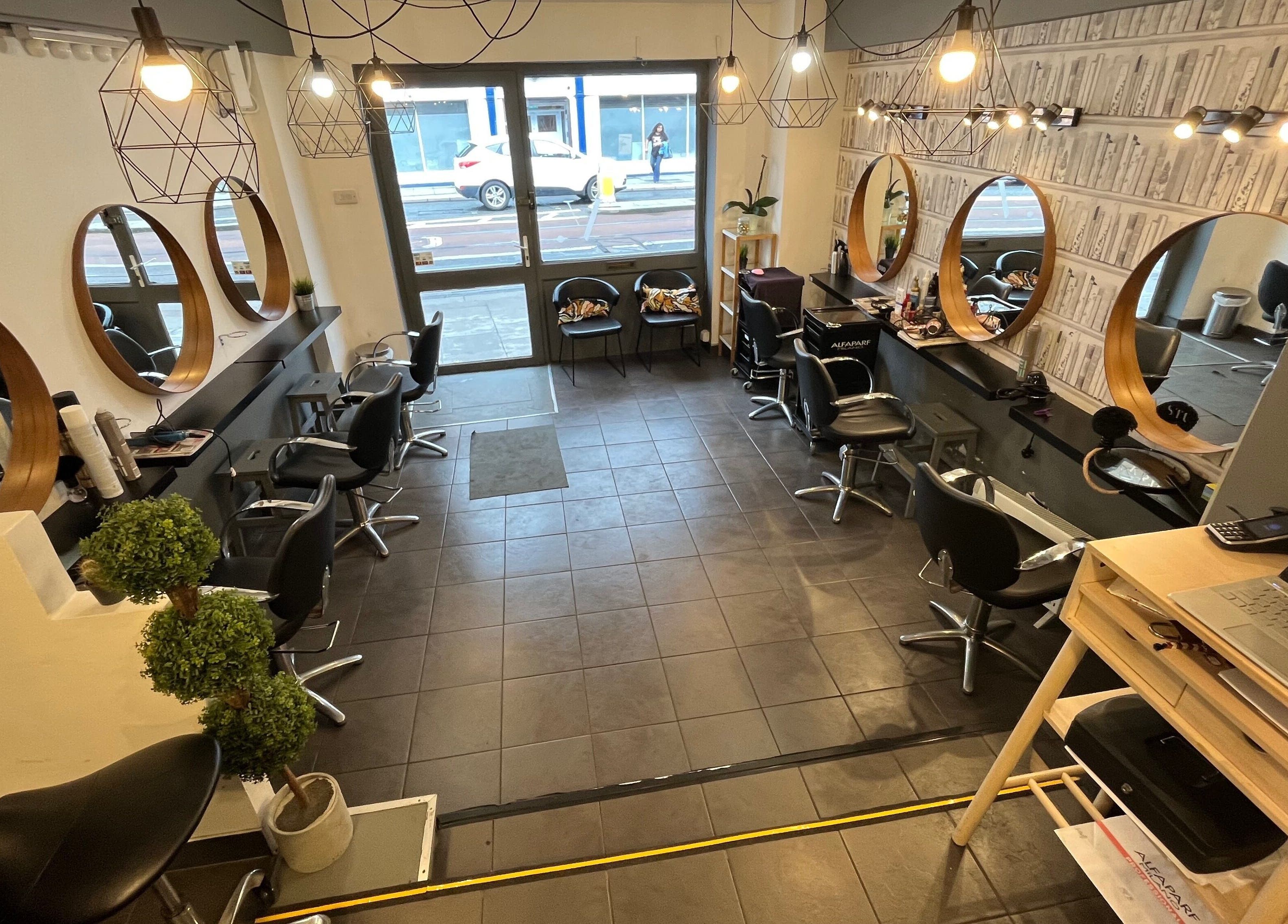 Elegant interior of MP Studio Hair in Dublin, County Dublin, IE, featuring stylish mirrors and seating.