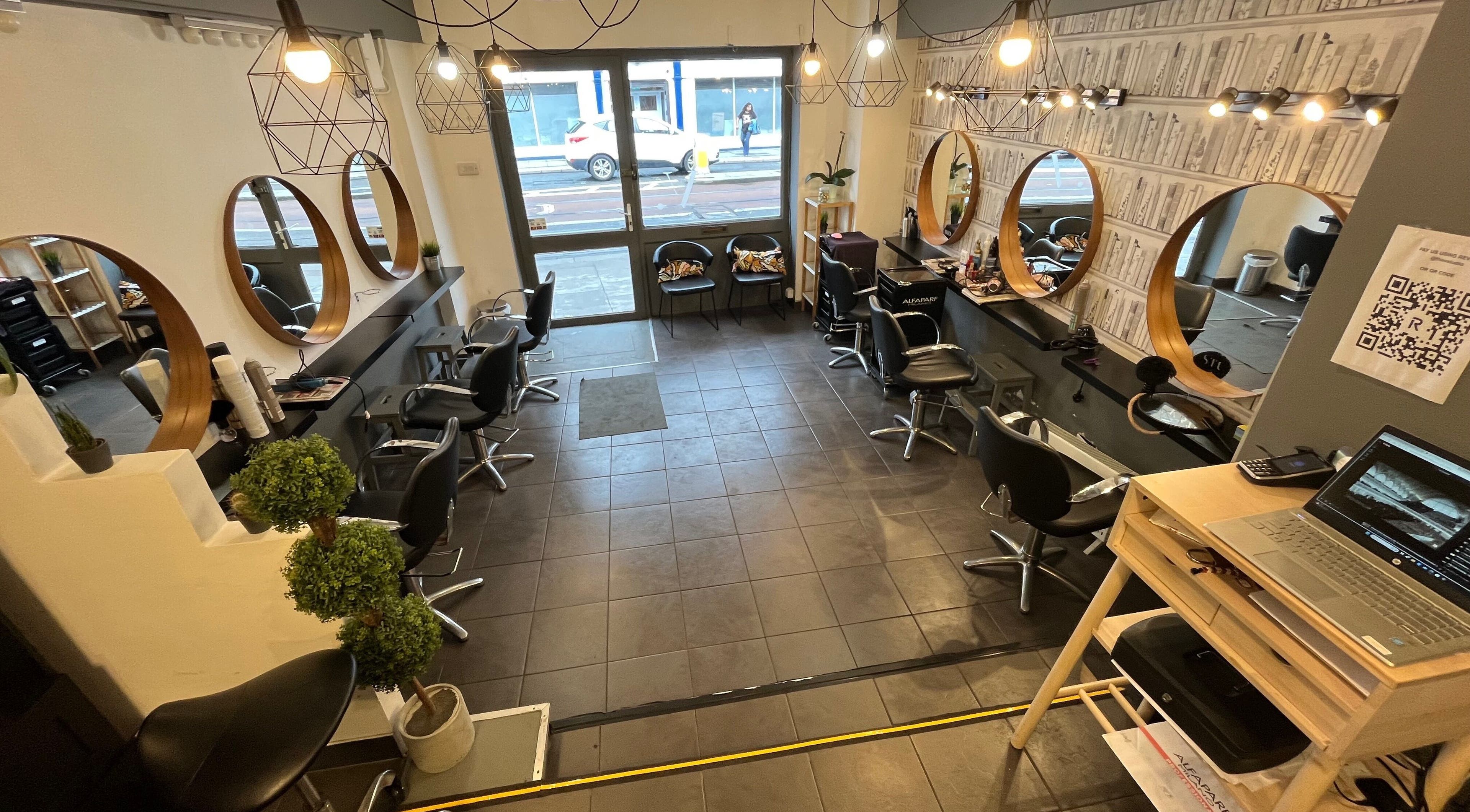 Elegant interior of MP Studio Hair in Dublin, County Dublin, IE, featuring stylish mirrors and seating.