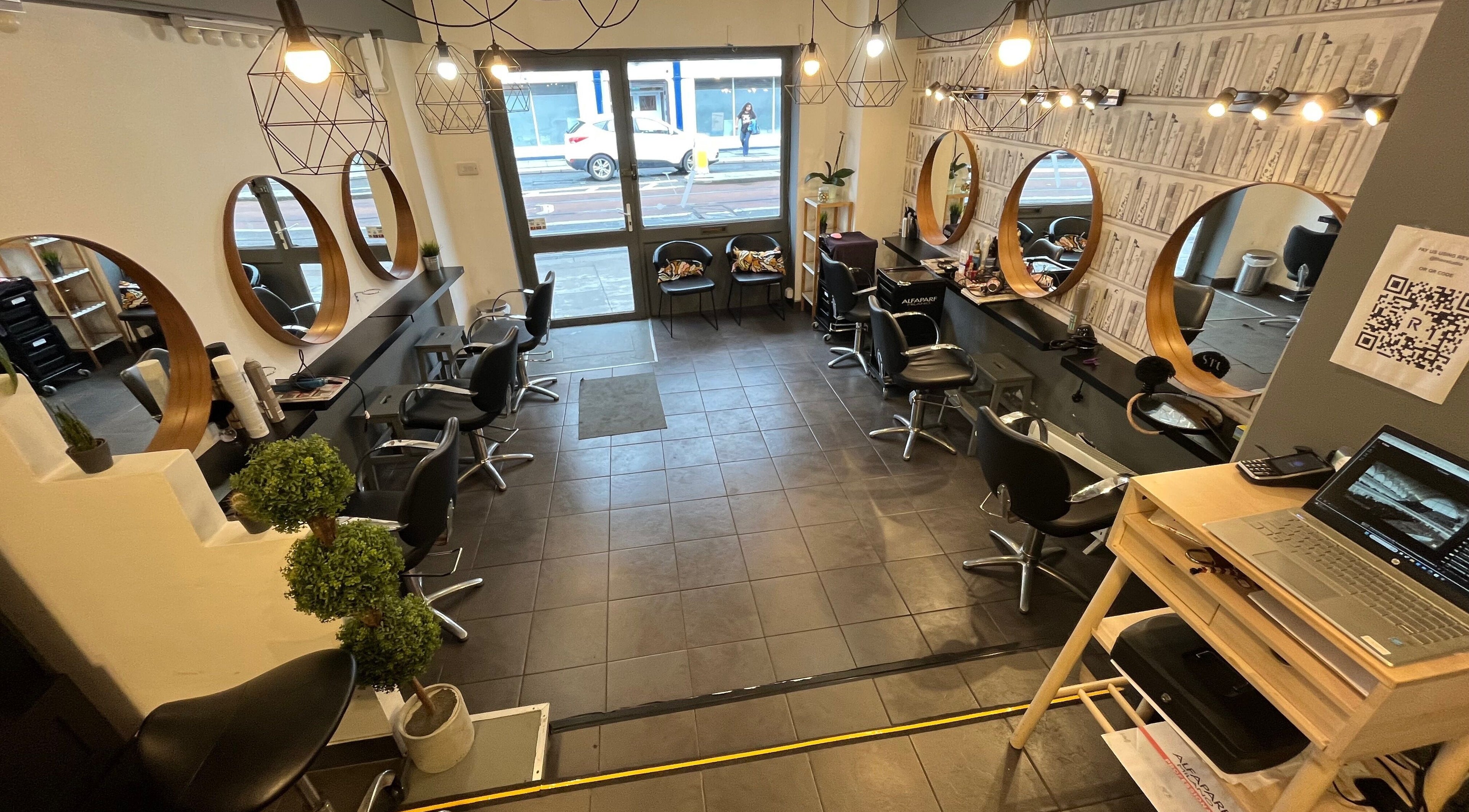 Elegant interior of MP Studio Hair in Dublin, County Dublin, IE, featuring stylish mirrors and seating.