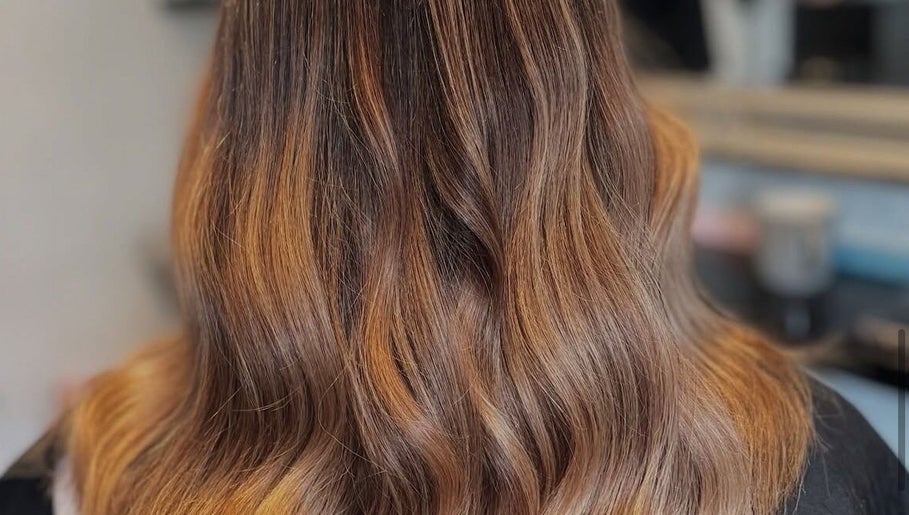 Beautiful wavy hairstyle from Hair by Abigail in Nairn, Scotland, GB, showcasing rich, golden highlights.