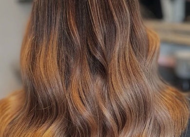 Beautiful wavy hairstyle from Hair by Abigail in Nairn, Scotland, GB, showcasing rich, golden highlights.