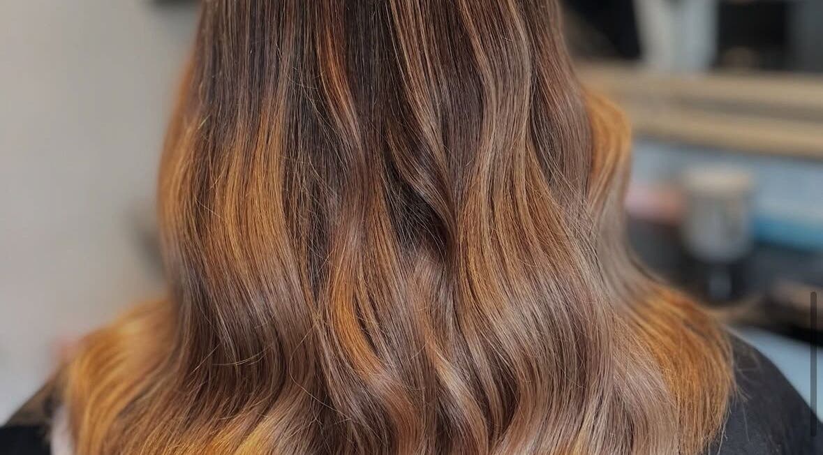 Beautiful wavy hairstyle from Hair by Abigail in Nairn, Scotland, GB, showcasing rich, golden highlights.