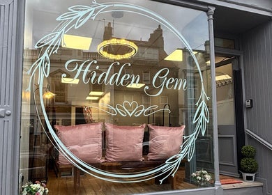 Charming front of Hair by Caitlyn Watney in Berwick-upon-tweed, England with plush seating and elegant decor.