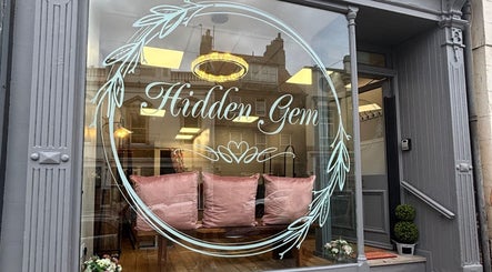 Charming front of Hair by Caitlyn Watney in Berwick-upon-tweed, England with plush seating and elegant decor.