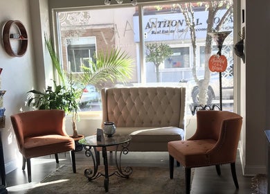 Elegant seating area at Meraki Beauty Studio in Canonsburg, Pennsylvania with natural light and cozy decor.