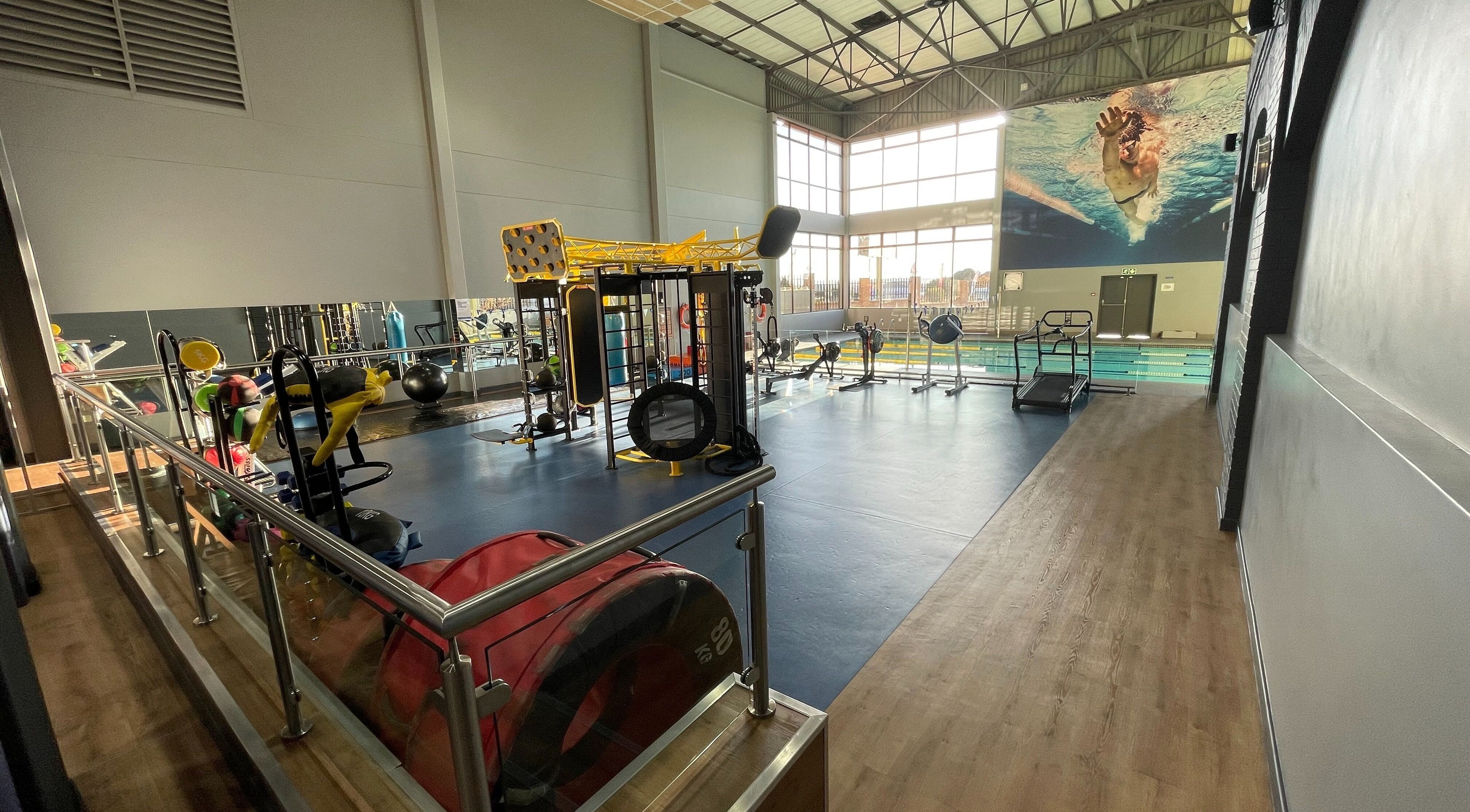 State-of-the-art fitness area at Khyla Kotzé Biokineticist, Roodepoort, Gauteng, ZA with pool view.