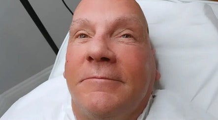 Client enjoying a facial treatment at Olive Stone Skin Clinic in Chichester, England, GB.