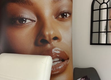 Sleek interior at Olive Stone Skin Clinic, Chichester, England. Aesthetic decor enhancing client relaxation.