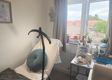Cozy treatment room at Olive Stone Skin Clinic, Chichester, England, GB, highlighting serene ambiance and wellness focus.
