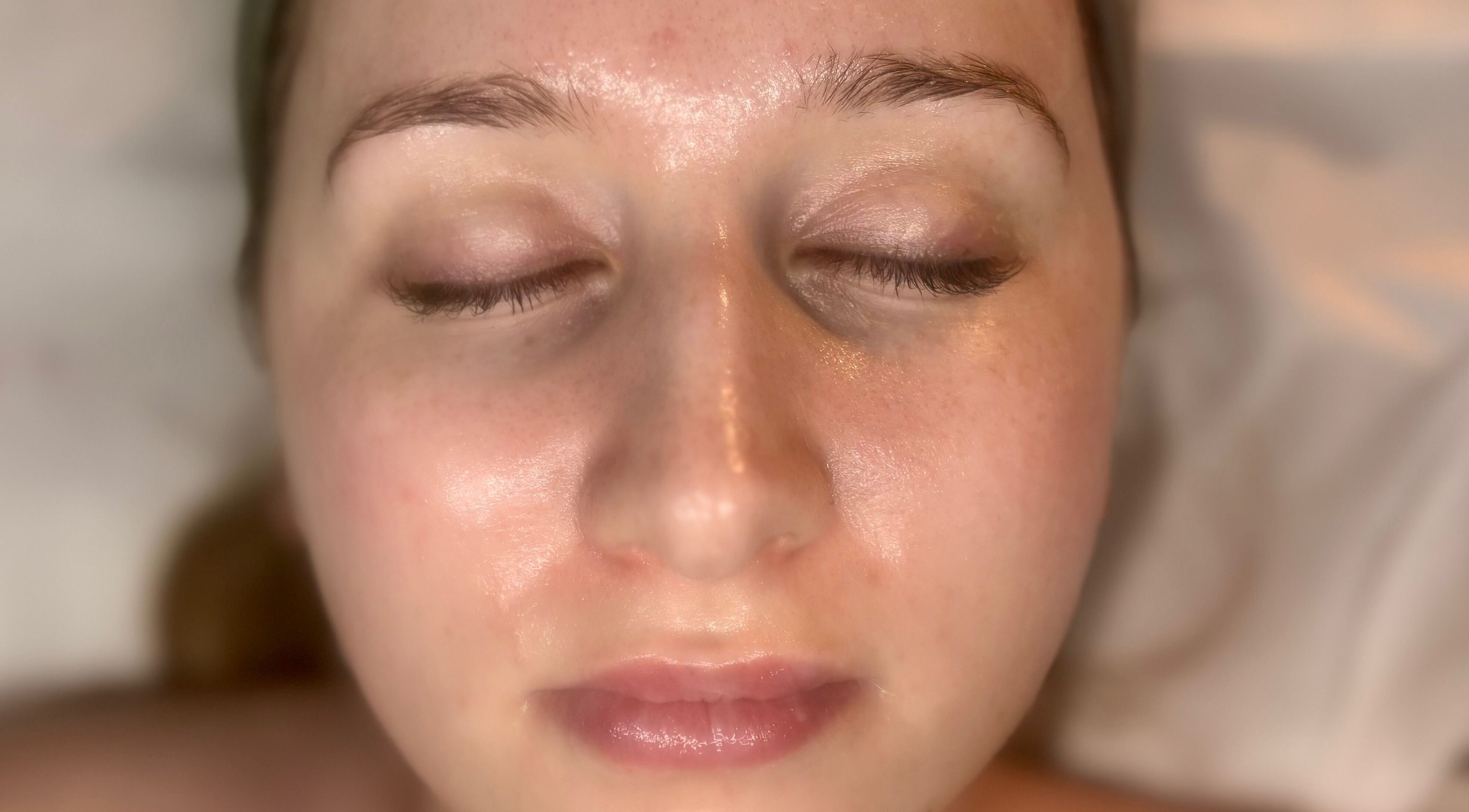 Close-up of a serene face after a facial at Olive Stone Skin Clinic, Walberton, England, GB.