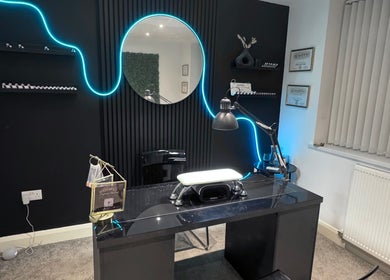 Stylish nail station at Gemini Beauty Lounge, Newthorpe, England, GB with ambient neon lighting.