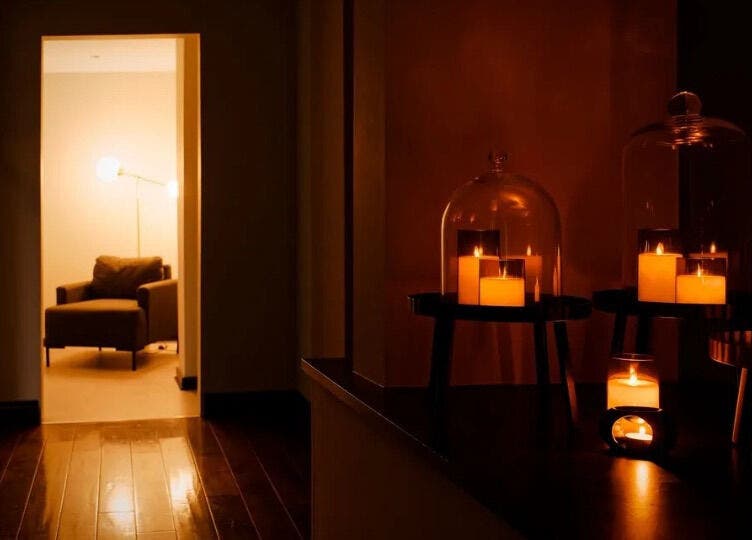 Candlelit relaxation area at The Head Spa Leeds, Leeds, England, GB, offering a warm and peaceful ambiance.