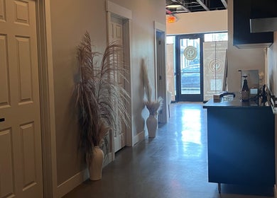 Chic hallway at AestheticsbyCliff SPA in Salt Lake City, Utah, US, featuring modern decor and natural light.