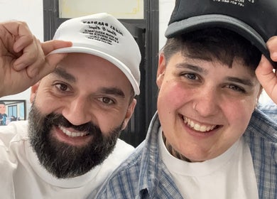 Two smiling people in hats at Minas Barbery, Enmore, New South Wales, AU.