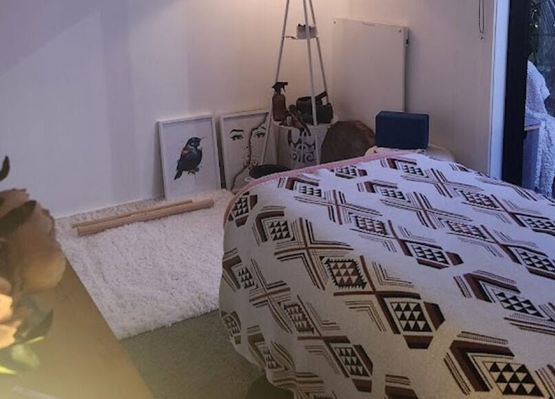 Tranquil wellness room at Kotiora, Ōtaki, Wellington, NZ with decorative artwork and calming decor.