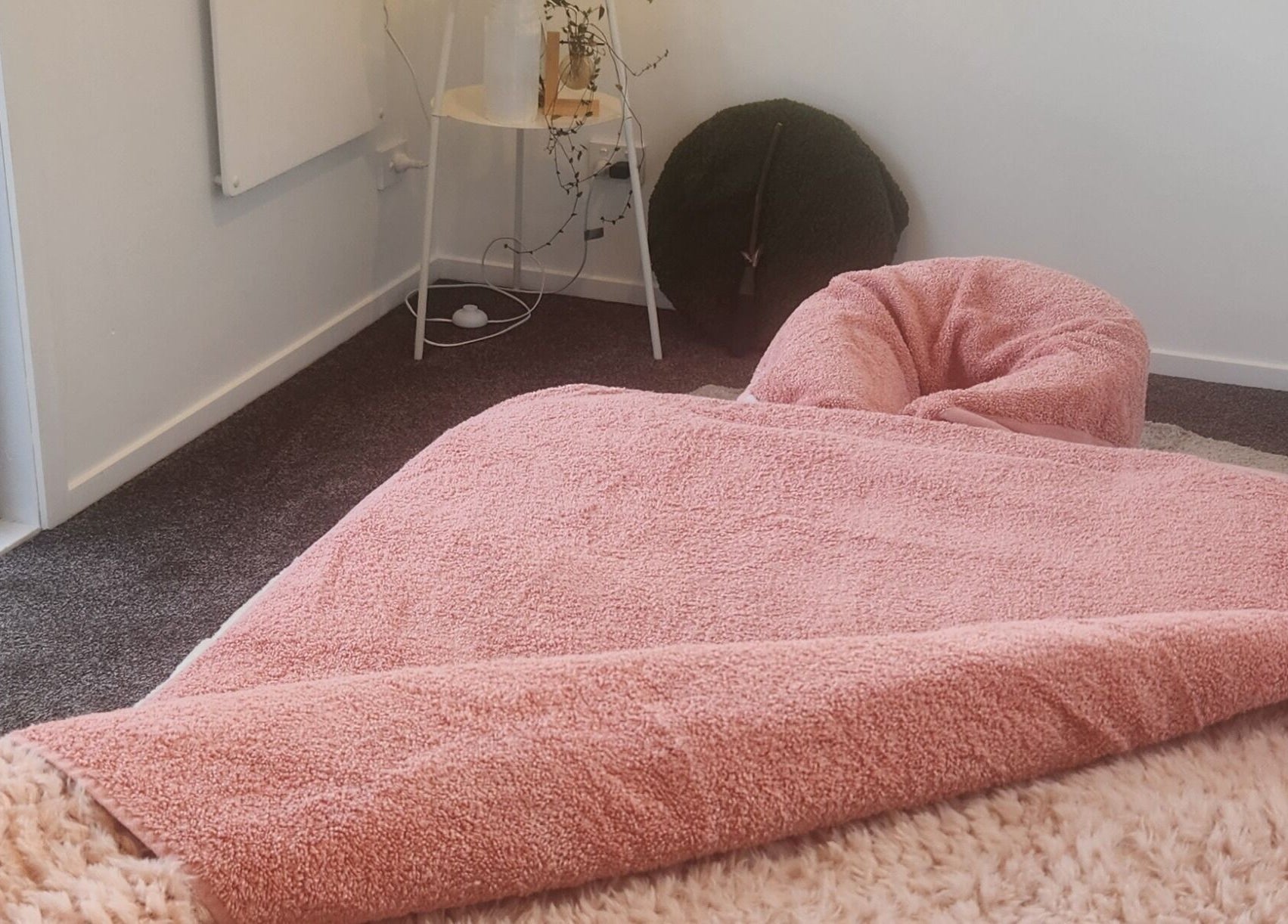 Relaxing treatment bed in Kotiora, Ōtaki, Wellington, NZ with pink and fluffy textures.
