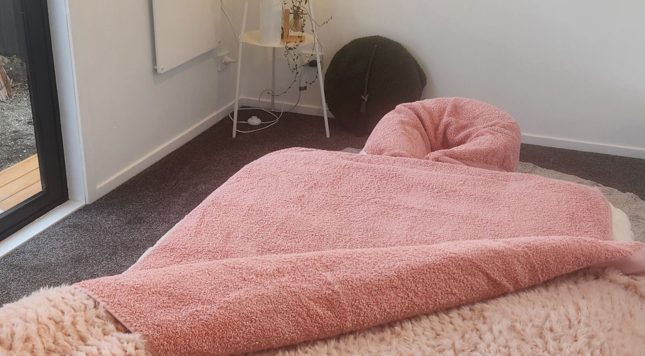 Relaxing treatment bed in Kotiora, Ōtaki, Wellington, NZ with pink and fluffy textures.