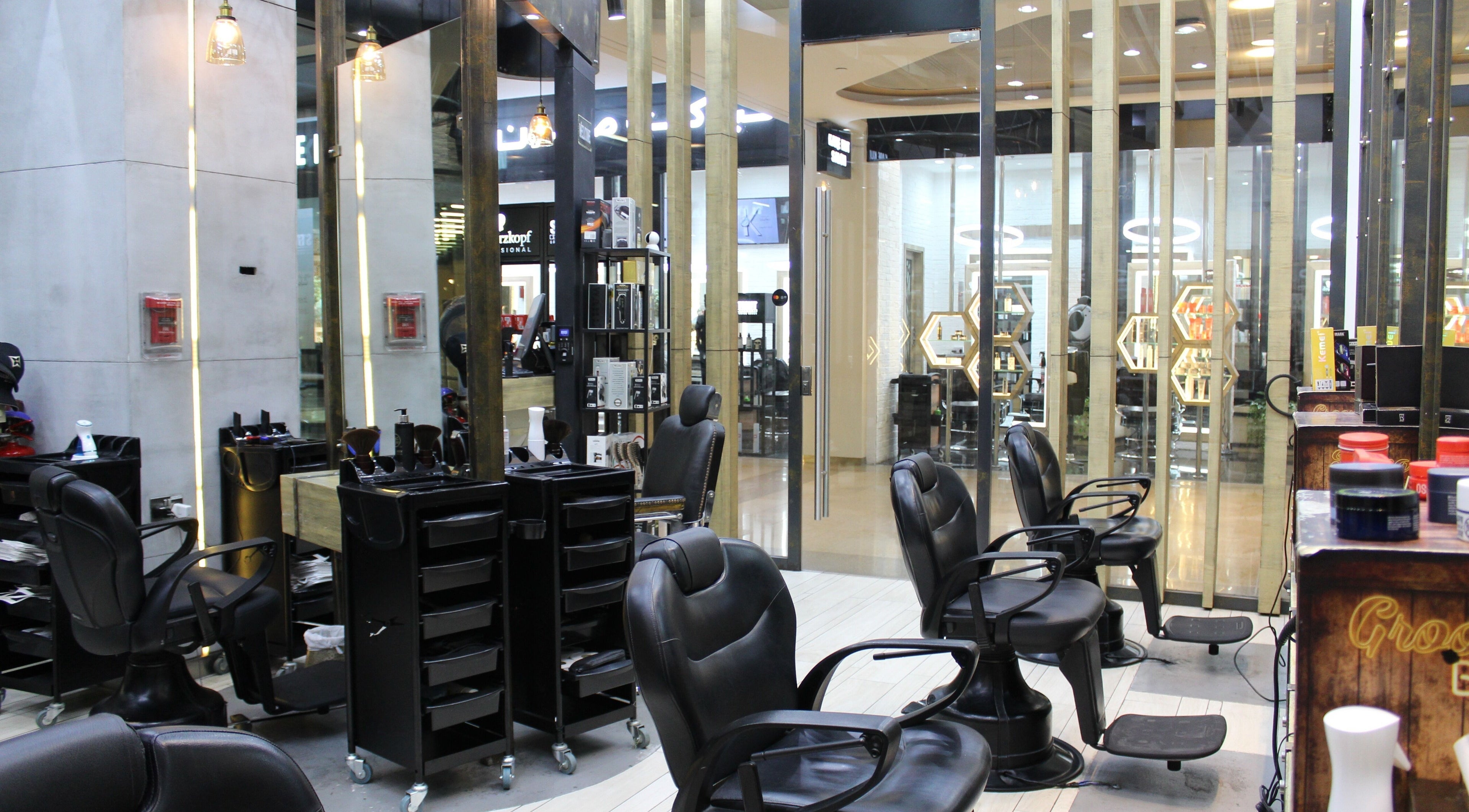 Interior of Graffio Gents Salon - Dubai Mall showcasing sleek barber chairs in Dubai, AE.