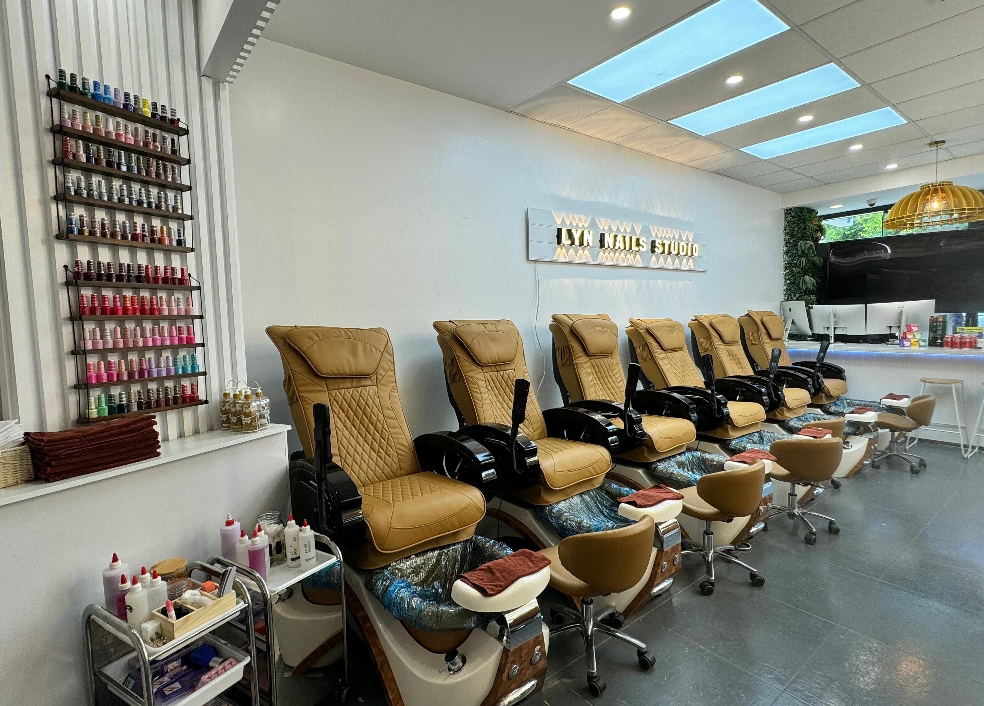 Luxurious nail spa chairs and polish display at LYN Nails Studio in Southport, Queensland, AU.