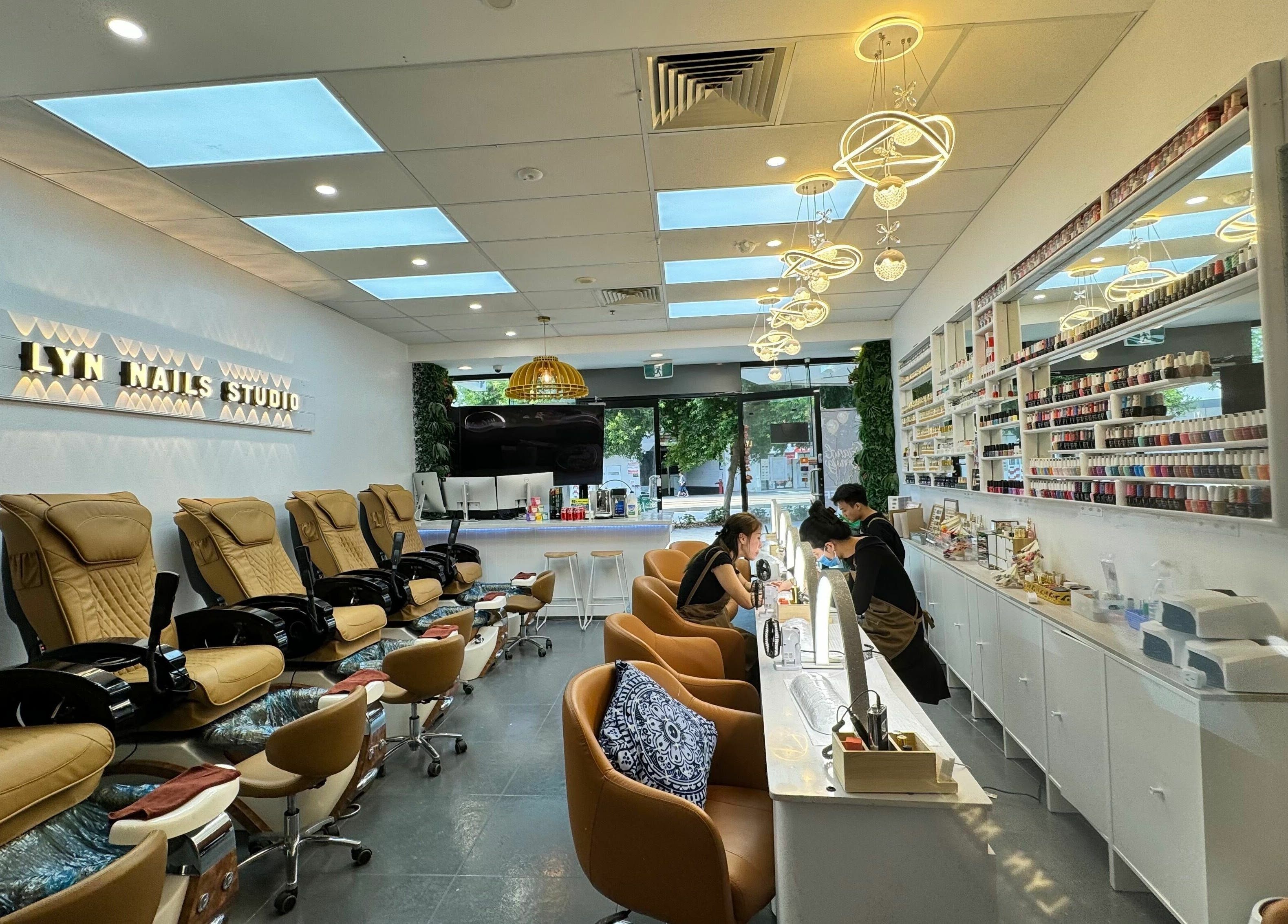 Inside LYN Nails Studio, Southport, Queensland, AU, showcasing stylish nail salon with plush seating and vibrant decor.