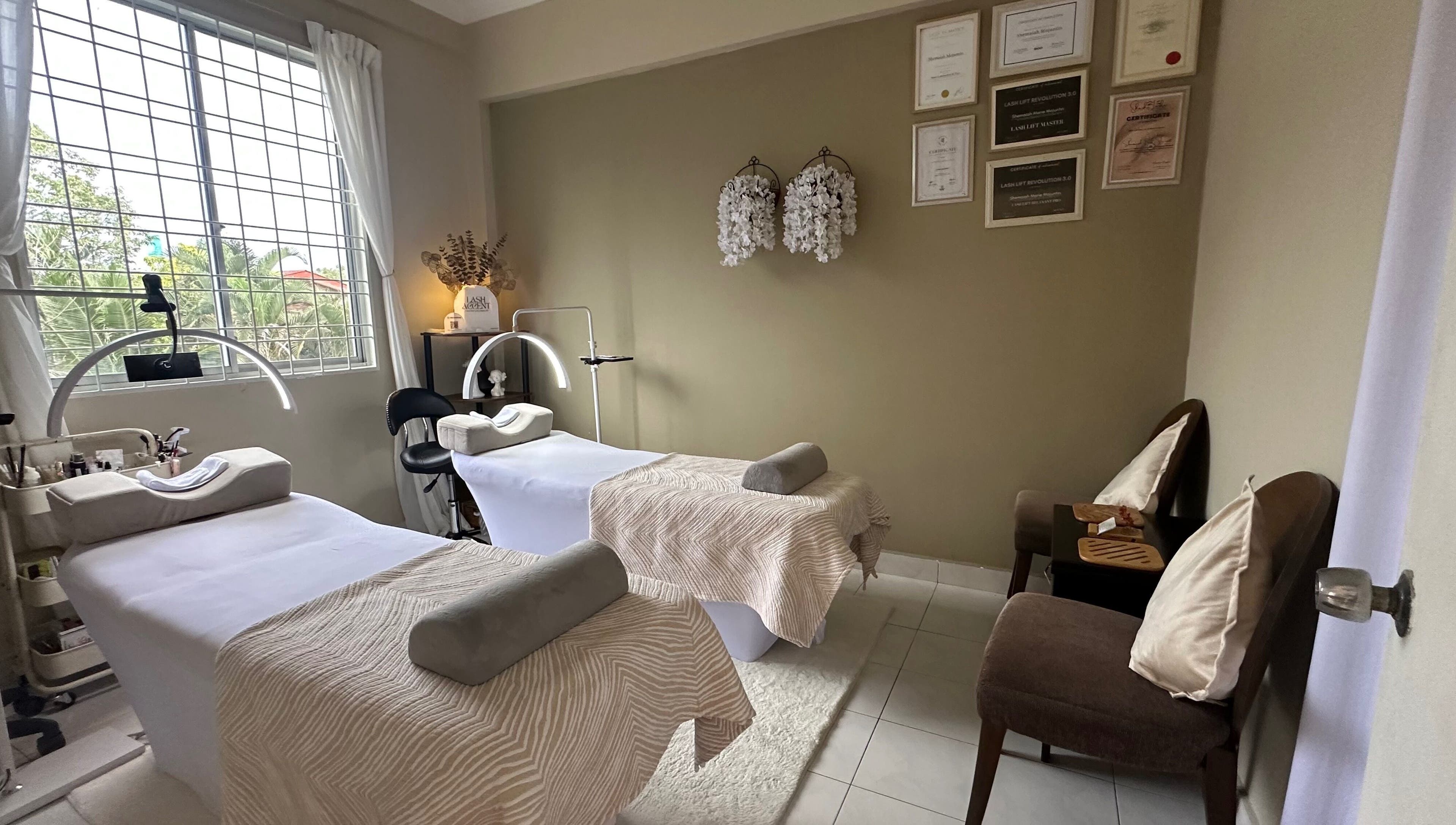 Serene massage room at Lash Accent, Kota Kinabalu, Sabah, MY with two treatment beds and elegant decor.