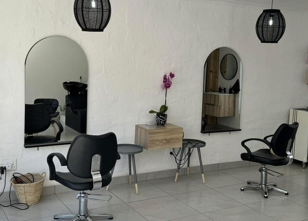 Modern salon interior at Lu Bella Hair, Modimolle, Limpopo, ZA. Elegant styling chairs and mirrors.