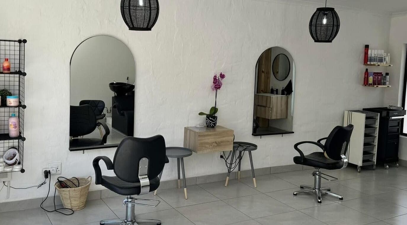 Modern salon interior at Lu Bella Hair, Modimolle, Limpopo, ZA. Elegant styling chairs and mirrors.