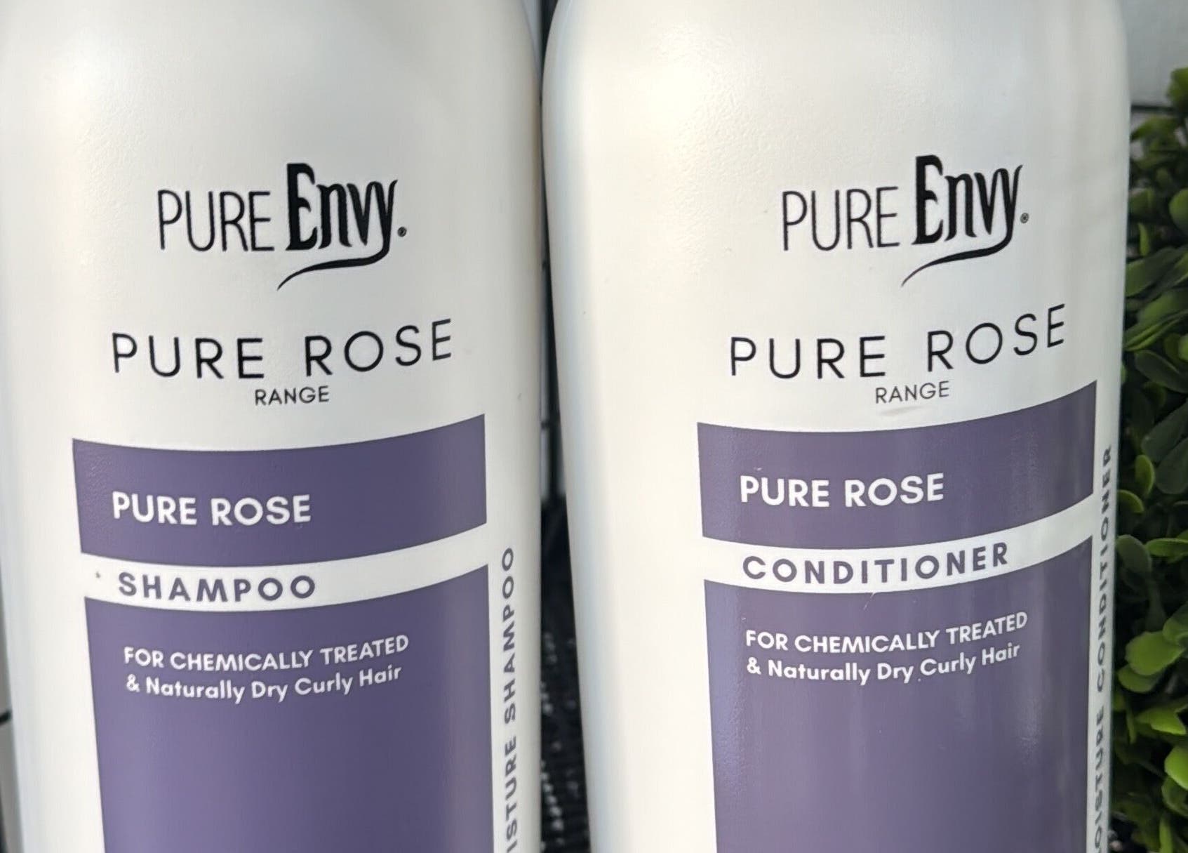 Lu Bella Hair in Modimolle, Limpopo, ZA displays Pure Rose shampoo and conditioner for dry hair.